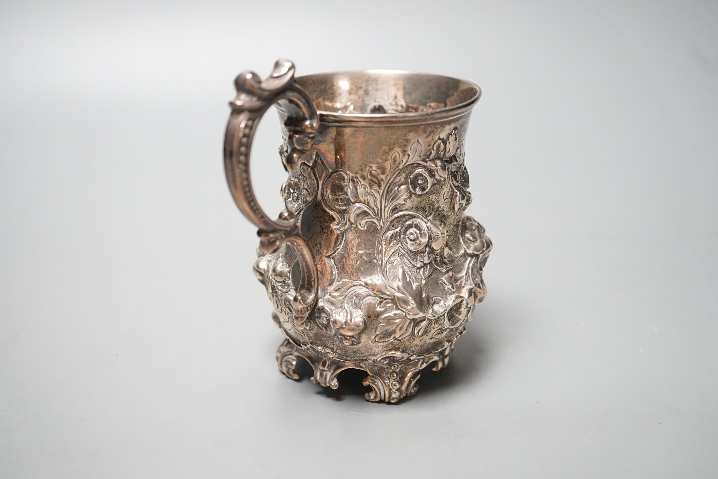 A Victorian embossed silver christening mug, Martin, Hall & Co, Sheffield, 1866, with engraved inscription, 12cm, 8oz.